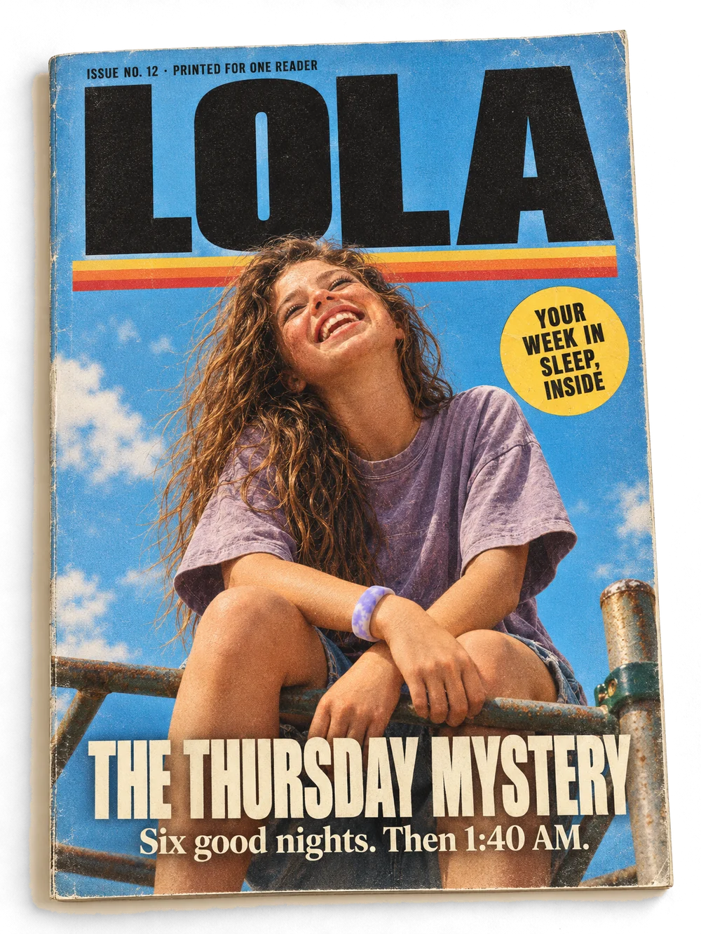 Lola’s own magazine, issue 12, printed for one reader. On the cover she laughs on top of a climbing frame in a lilac Sky Loop, under the masthead LOLA. The cover line reads “The Thursday Mystery: six good nights, then 1:40 AM”.