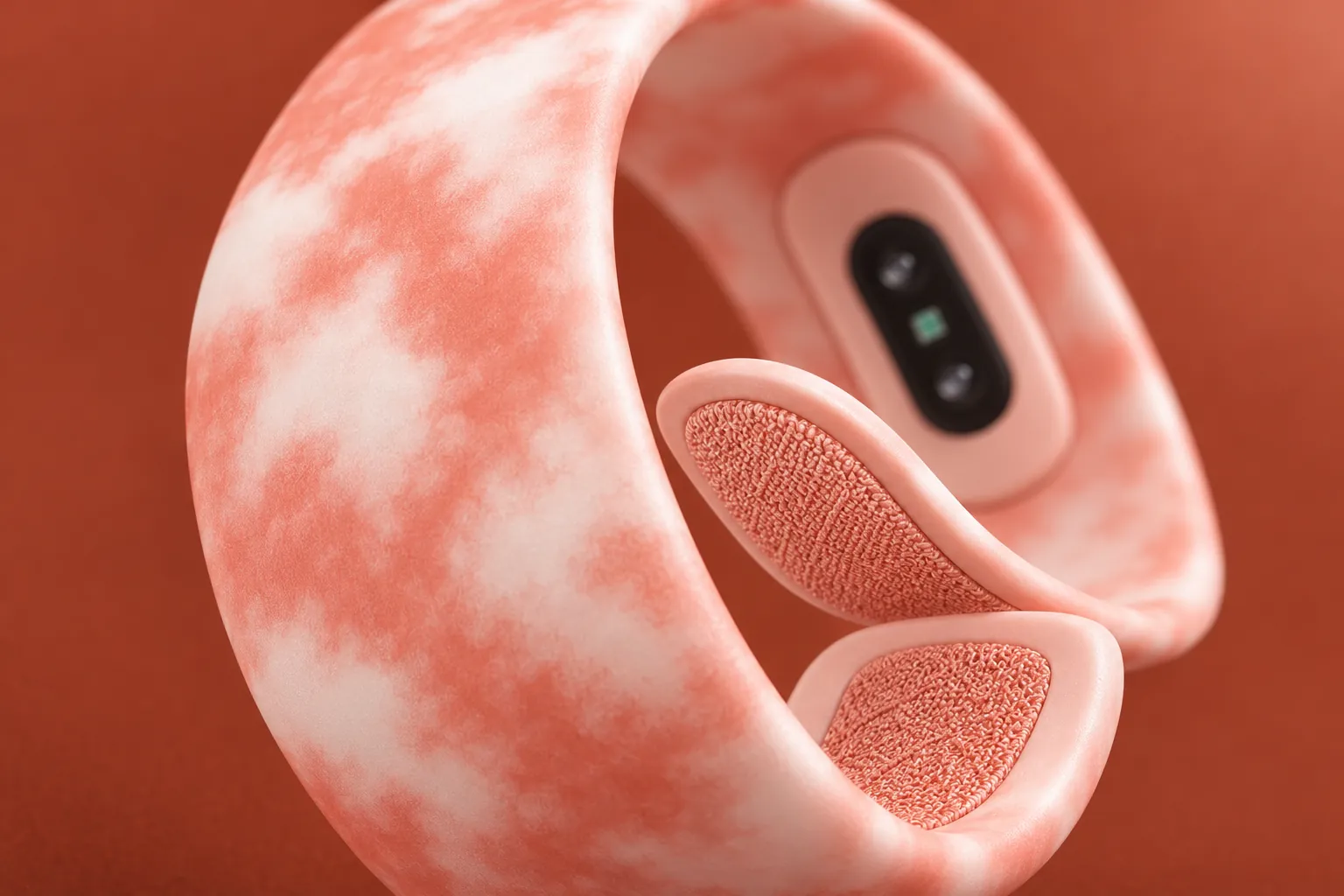 Close up on a peach Sky Loop: the soft cloud print outside, the sensor and the two textured closing pads inside